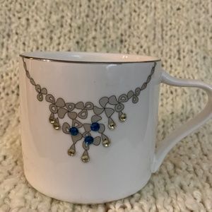 Verdici jewelled mug withh rhinestones on it.